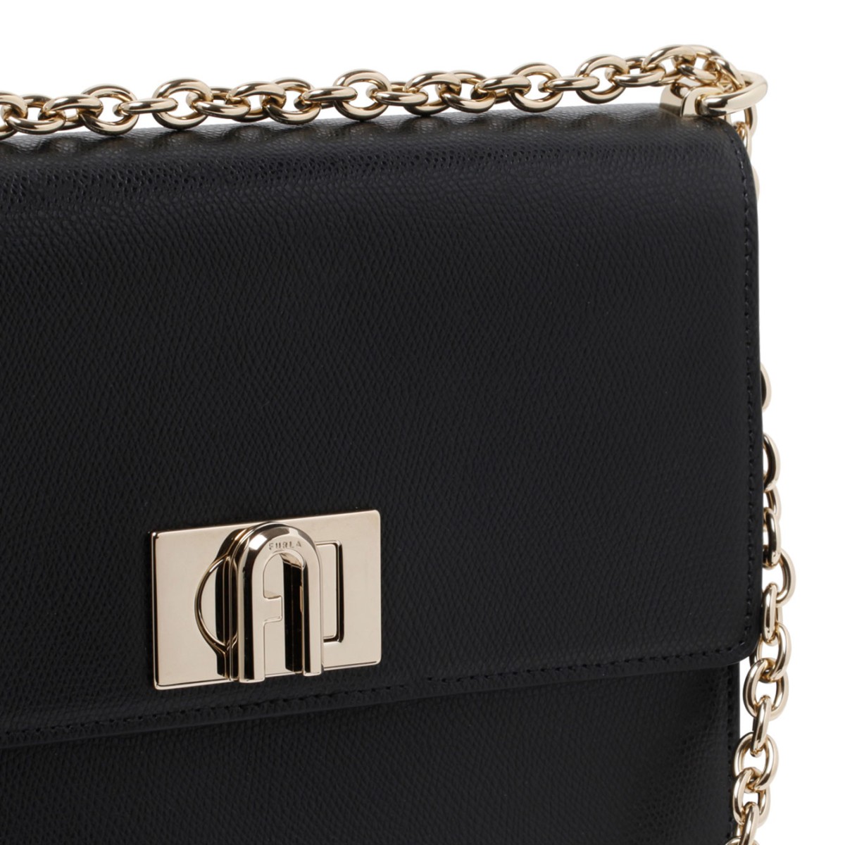 Furla 1927 Black Mini Crossbody, opening with front gold flip lock fastening.