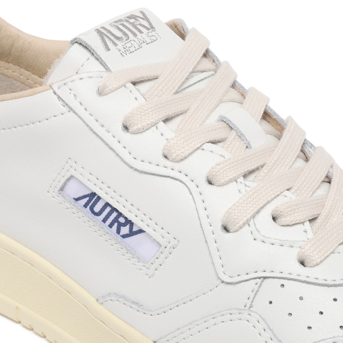 Autry White Leather Medalist Sneakers with Blue Heel Tab.