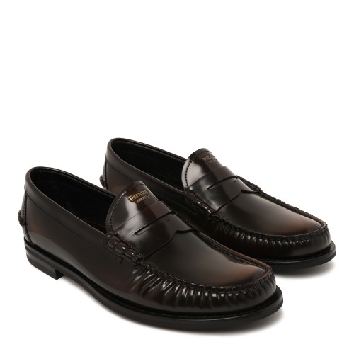 Prada Black Leather Penny Loafers. 2