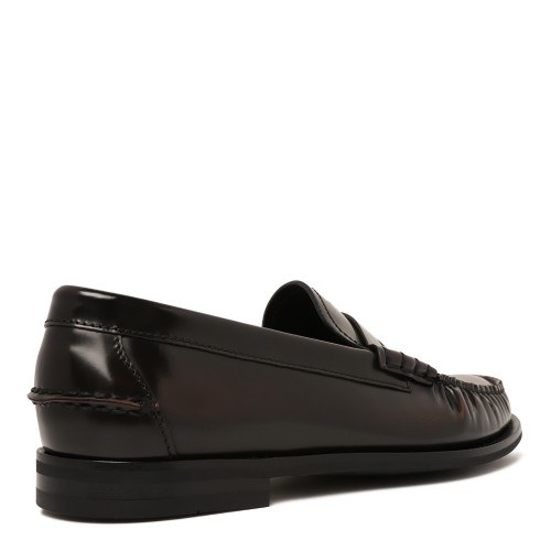 Prada Black Leather Penny Loafers.