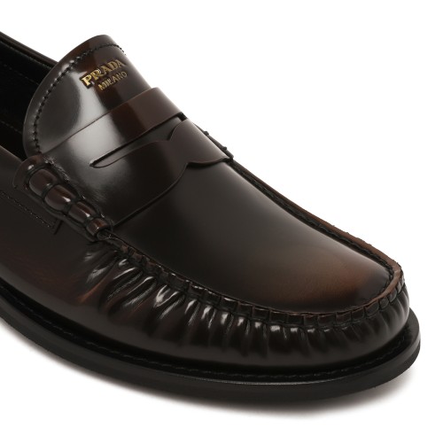 Prada Black Leather Penny Loafers.