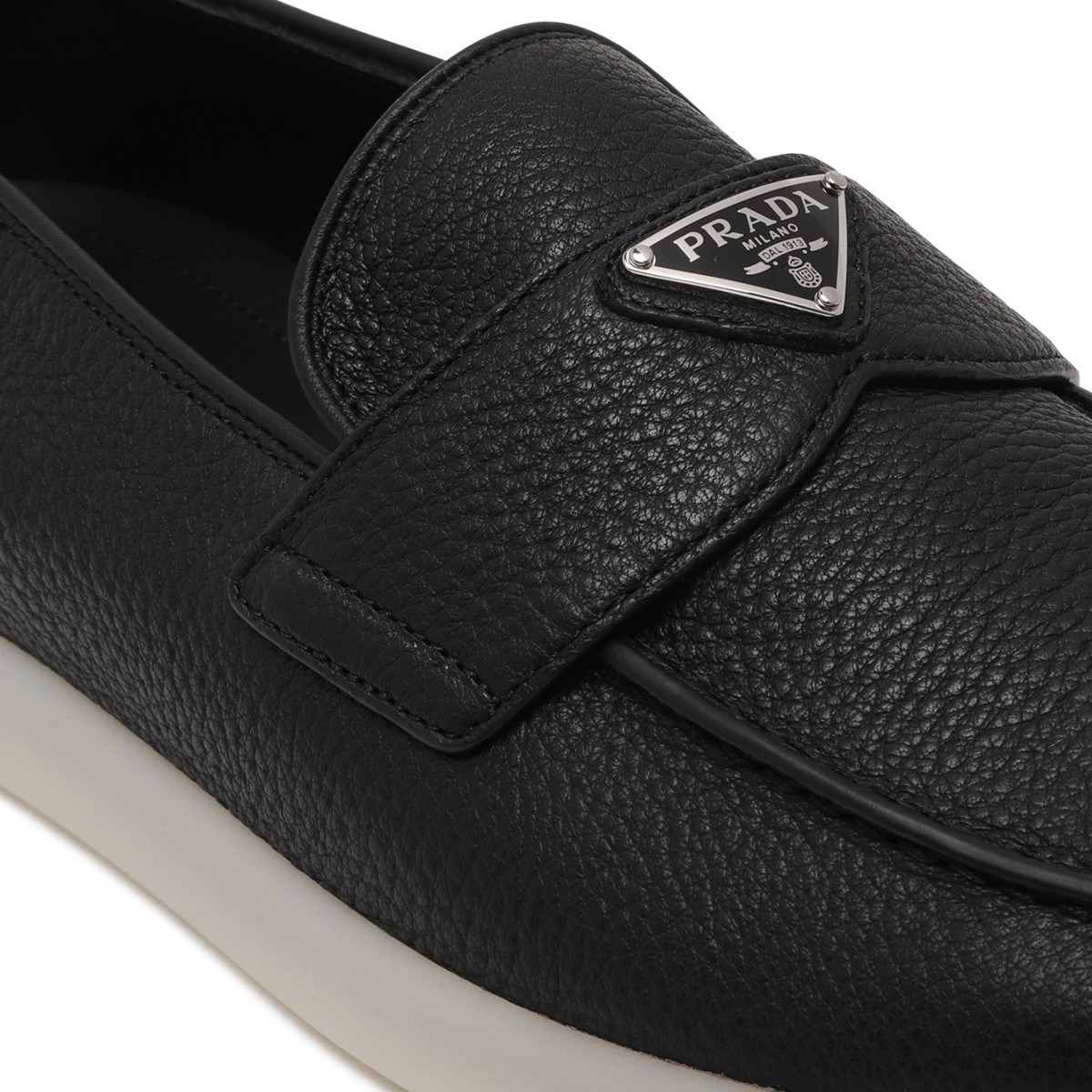Prada Black Leather Slip-On Loafers.